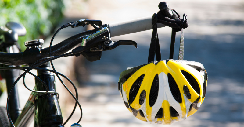 Image of a bike with a helmet hanging off the handles