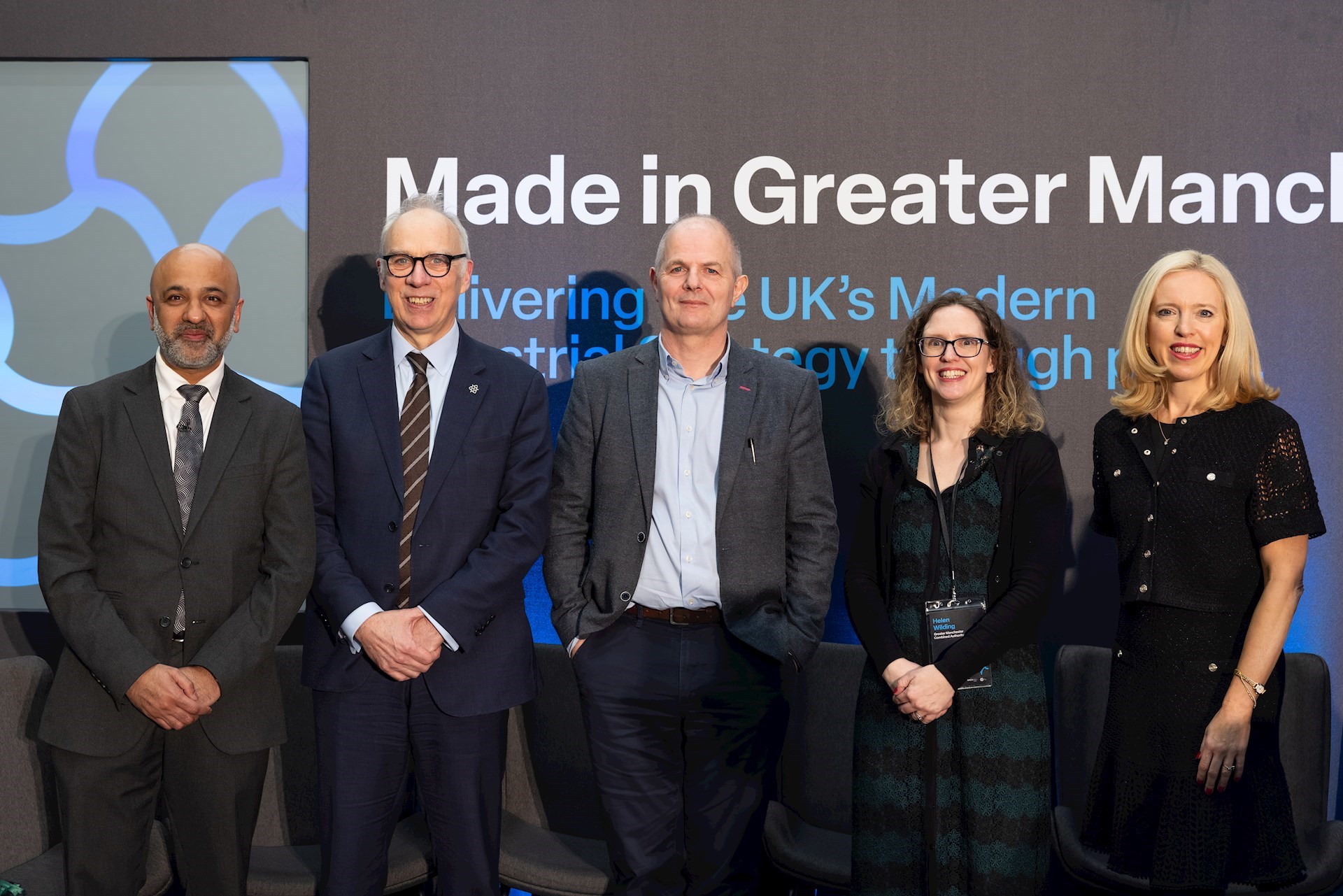 Mark Hughes with the other guest speakers at the event with Made in Greater Manchester in the background