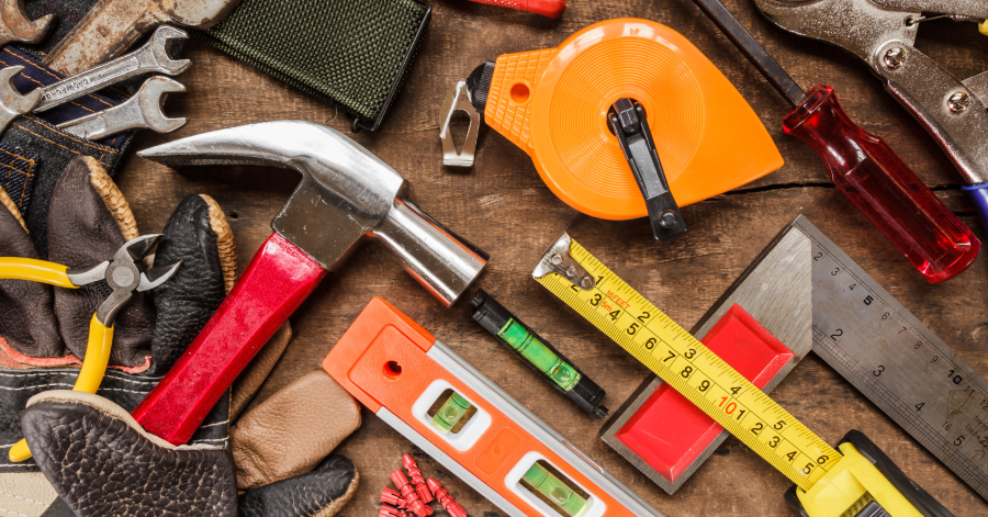 Variety of tools for repairing items displayed on a table 