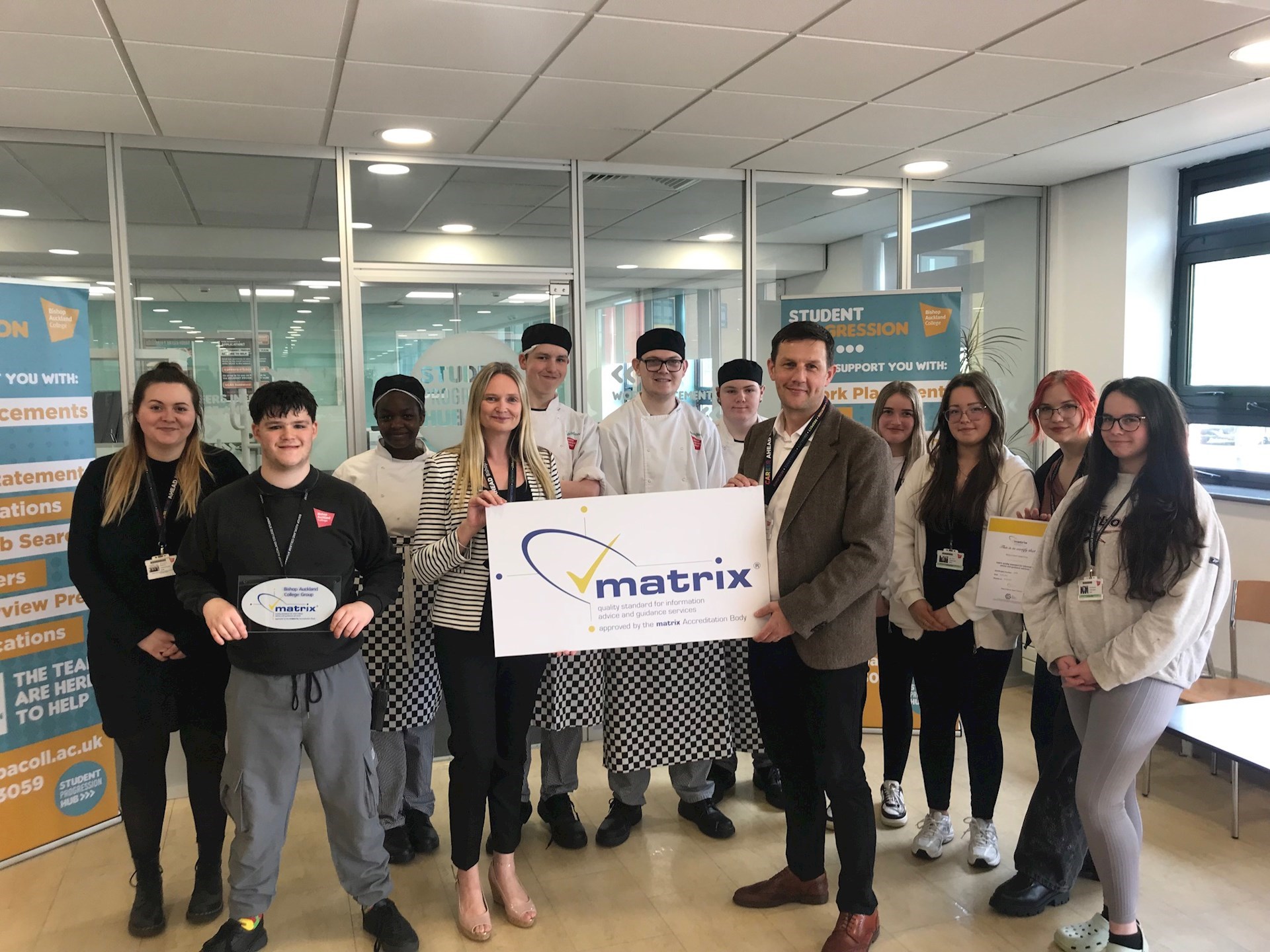 Bishop Aukland college staff and students holding their matrix certificate 