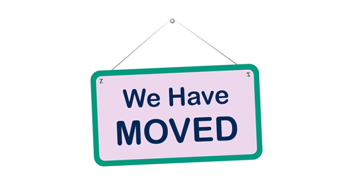 Pink sign with blue text that reads: We Have Moved